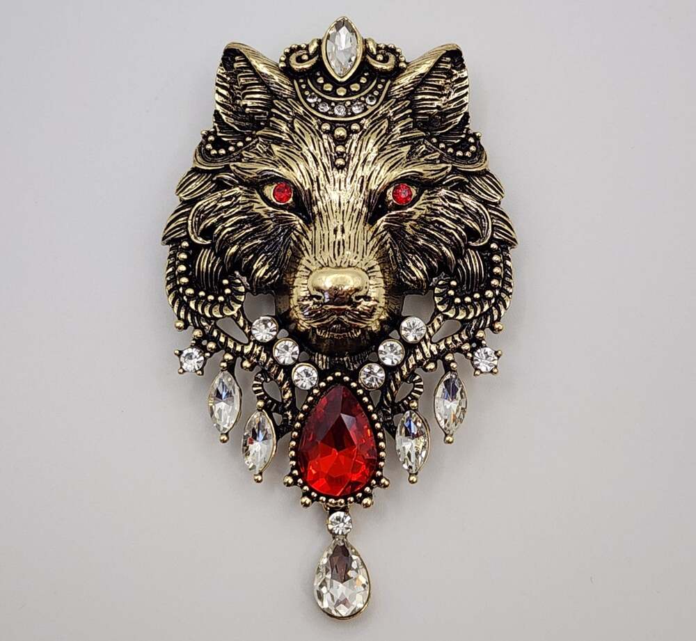 Decorative Gold Tone Wolf brooch with Faux Red Gemstone & Rhinestones
